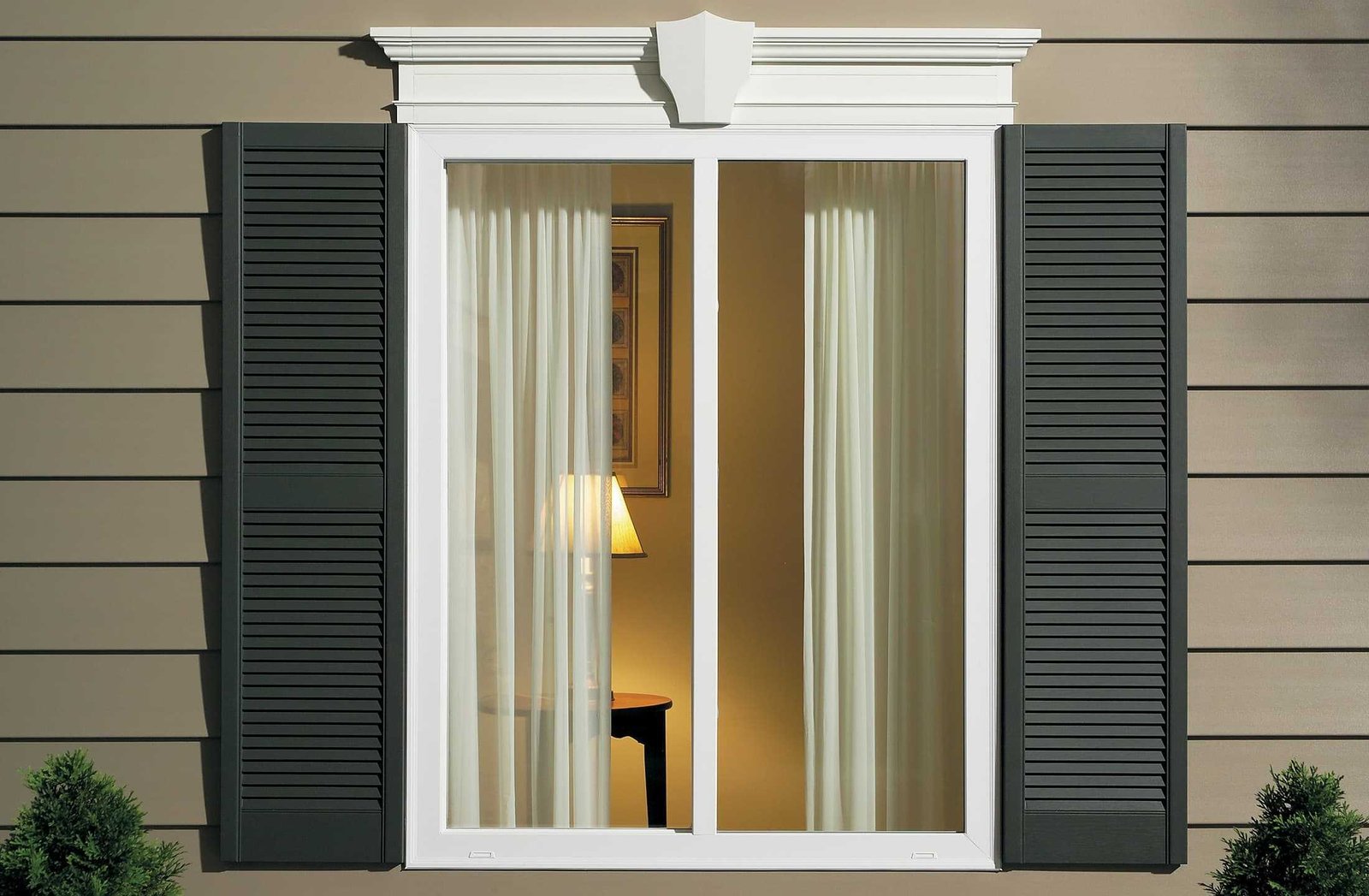 Close-up of installed white sliding window with shutters